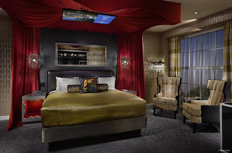 The bedroom of the King’s Suite 1 features a TV mounted on the canopy over the bed. JEFFREY JACOBS